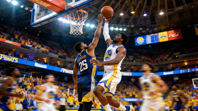 NBA总决赛现场比赛画面，球员在篮下激烈对抗并准备完成关键投篮